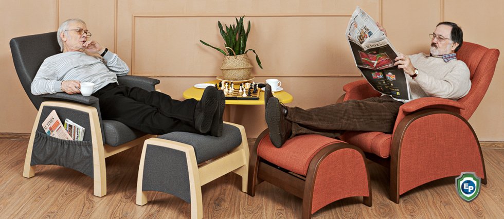 Two men relaxing in glider chairs